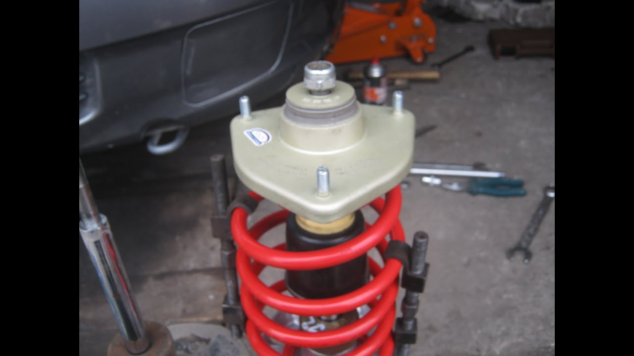 Cambiar os soportes, resortes e rodamentos dianteiros por rodamentos no VAZ 2110