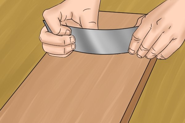 Hoe gebruik je een platte kastschraper?